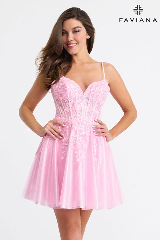 Woman wearing a pink dress with Faviana branding on a white background