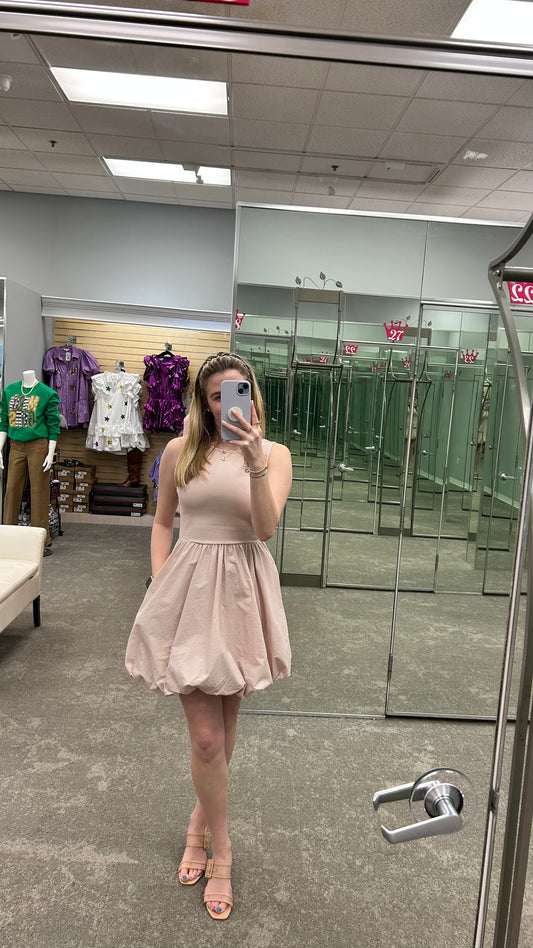 Model wearing the Palermo Dress in Cameo Rose, featuring a flowy midi silhouette, and soft satin finish.