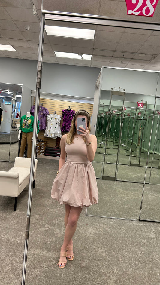 Model wearing the Palermo Dress in Cameo Rose, featuring a flowy midi silhouette, and soft satin finish.