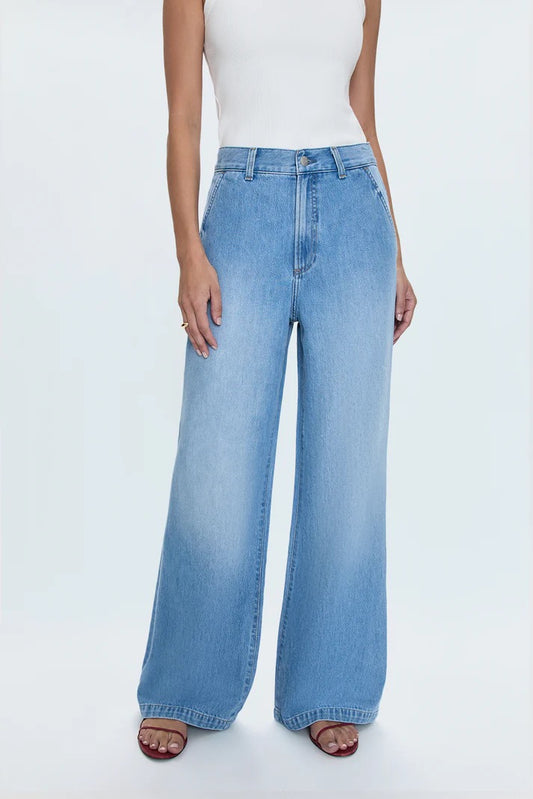 Model wearing Pistola Dalia High Rise Wide Leg Jeans in Palo Alto with white tank and sandals